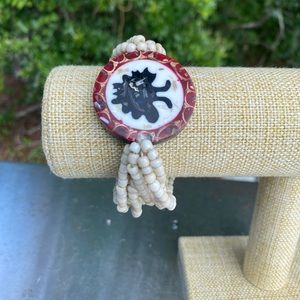 White Beaded Bracelet with Red/White/Black center